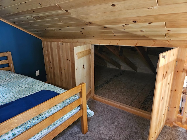 37791 Mallard Loop, Edna Twp, MN 56573 - bedroom featuring wood ceiling, wood walls, and carpet flooring