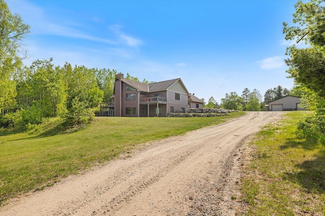 32305 Little E Lake Rd, Bigfork, MN 56628 - view of front of home featuring a front yard, a garage, and a chimney