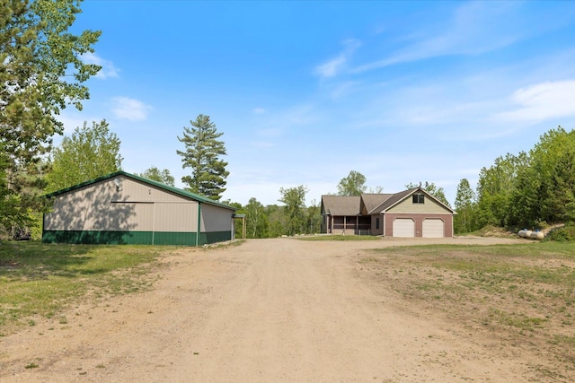 32305 Little E Lake Rd, Bigfork, MN 56628 - view of dirt / gravel driveway featuring a pole building