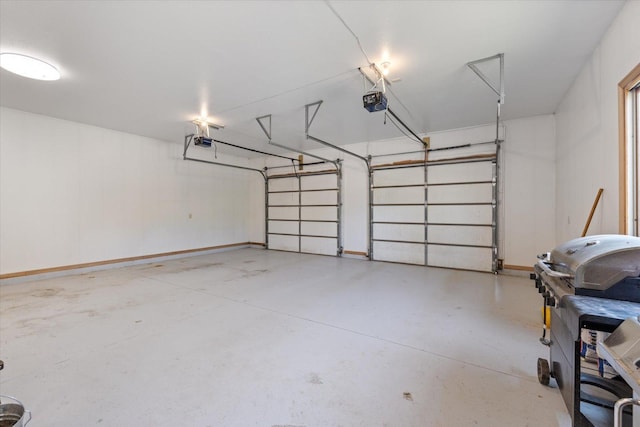 32305 Little E Lake Rd, Bigfork, MN 56628 - garage with a garage door opener and baseboards