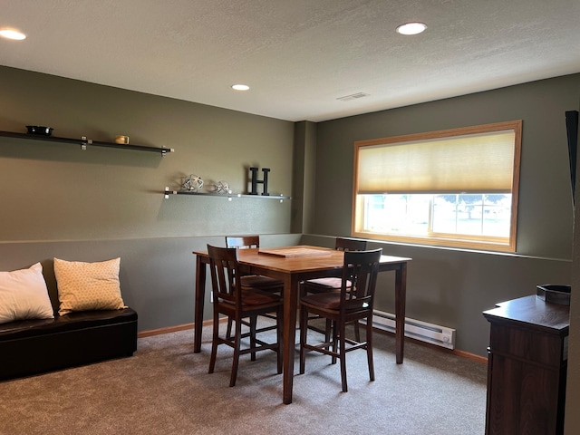 728 7th St, Litchfield, MN 55355 - carpeted dining space with baseboard heating, baseboards, recessed lighting, and a textured ceiling