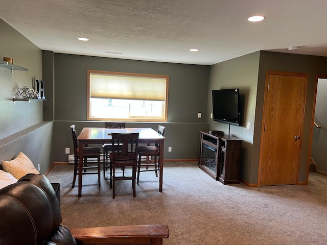 728 7th St, Litchfield, MN 55355 - carpeted dining room with recessed lighting, baseboards, and a textured ceiling