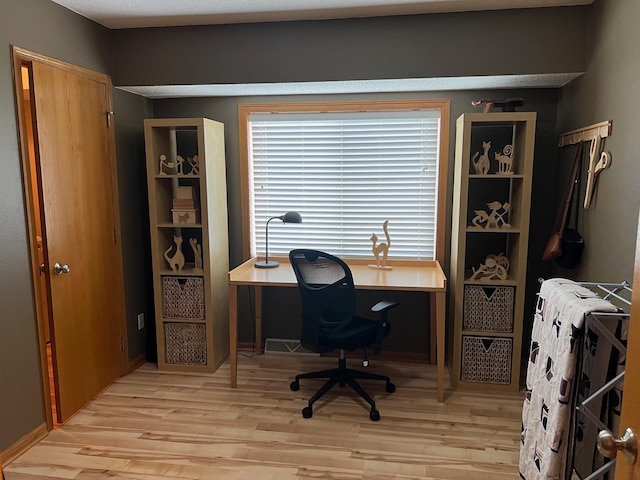 728 7th St, Litchfield, MN 55355 - home office with light wood-style floors