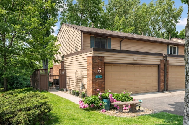 4839 Spring Cir, Minnetonka, MN 55345 - view of front facade featuring brick siding and driveway