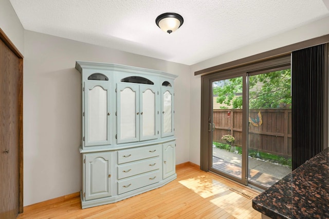 4839 Spring Cir, Minnetonka, MN 55345 - doorway featuring light wood-type flooring and a textured ceiling