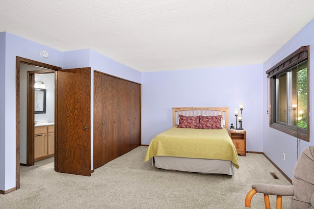 4839 Spring Cir, Minnetonka, MN 55345 - bedroom with light carpet, a textured ceiling, and a closet
