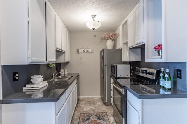 433 7th St Unit 2317, Minneapolis, MN 55415 - kitchen featuring stainless steel appliances, a sink, white cabinets, backsplash, and baseboards