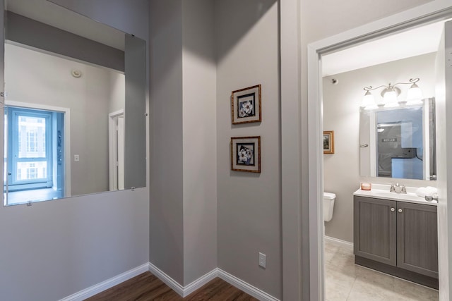 433 7th St Unit 2317, Minneapolis, MN 55415 - corridor with baseboards and a sink