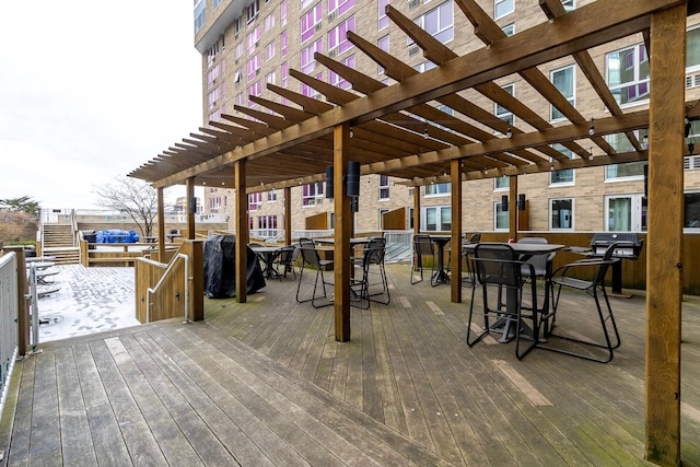 433 7th St Unit 2317, Minneapolis, MN 55415 - wooden deck featuring a pergola and outdoor dining area