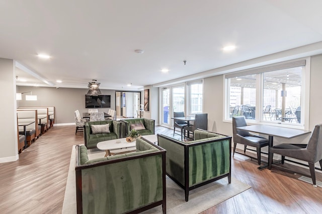 433 7th St Unit 2317, Minneapolis, MN 55415 - living area with light wood-type flooring, baseboards, and recessed lighting