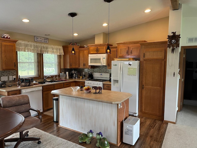 21250 Farm View Dr, Park Rapids, MN 56470 - kitchen with white appliances, a sink, brown cabinets, backsplash, and lofted ceiling