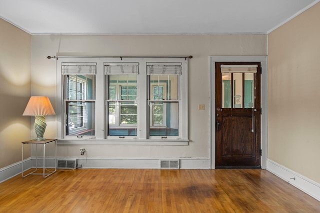 3553 Dupont Ave S, Minneapolis, MN 55408 - foyer with wood finished floors, ornamental molding, and baseboards