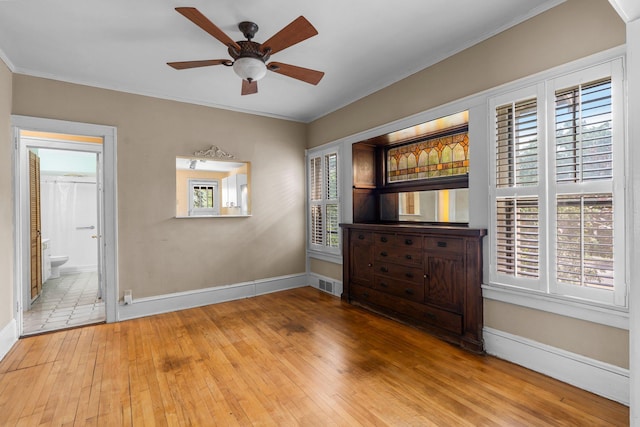 3553 Dupont Ave S, Minneapolis, MN 55408 - unfurnished room with hardwood / wood-style floors, healthy amount of natural light, a ceiling fan, ornamental molding, and baseboards
