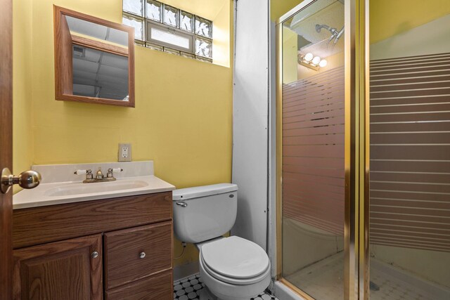 3553 Dupont Ave S, Minneapolis, MN 55408 - full bath with vanity, a stall shower, and toilet