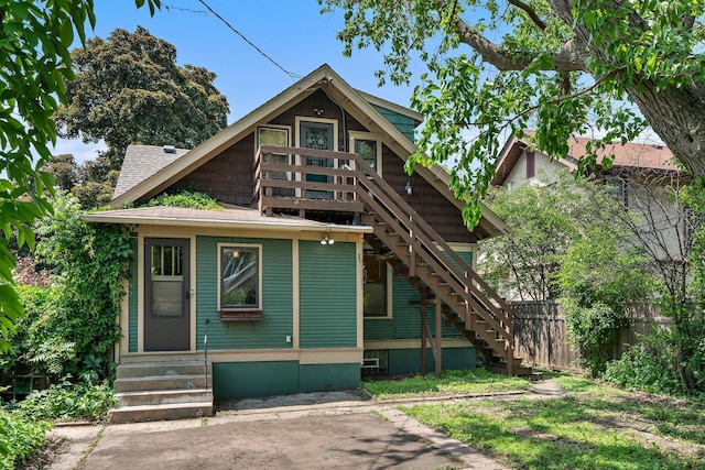 3553 Dupont Ave S, Minneapolis, MN 55408 - view of front facade with stairway, entry steps, and a shingled roof