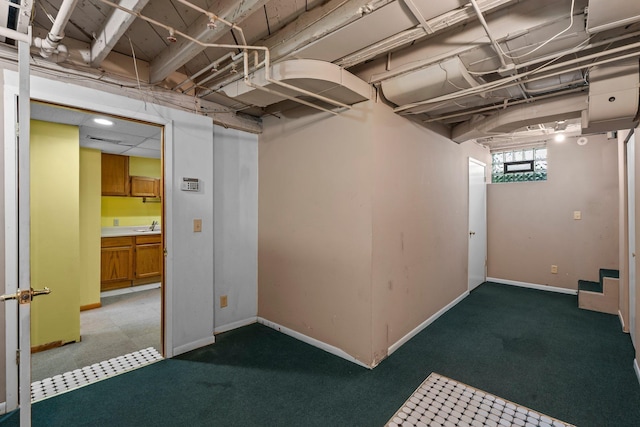 3553 Dupont Ave S, Minneapolis, MN 55408 - basement featuring baseboards and a sink