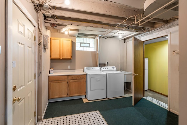 3553 Dupont Ave S, Minneapolis, MN 55408 - laundry room with washer and dryer, cabinet space, and baseboards