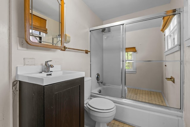 3553 Dupont Ave S, Minneapolis, MN 55408 - full bath featuring toilet, vanity, bath / shower combo with glass door, and tile patterned floors