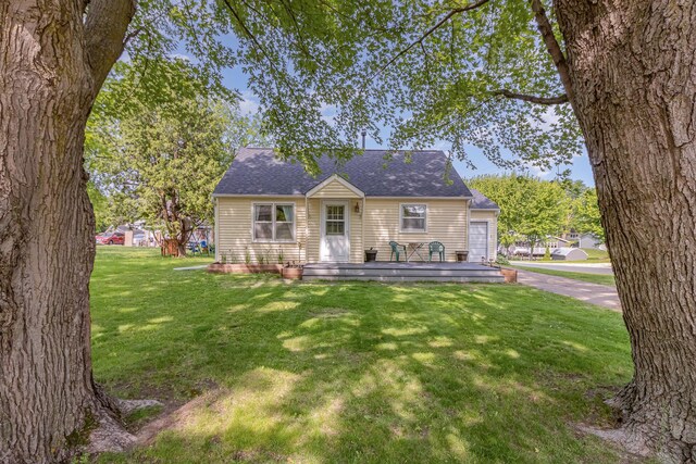 333 Main St N, Lonsdale, MN 55046 - view of front of property with a front yard, roof with shingles, and a wooden deck