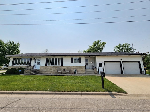 25 3rd Ave NE, Plainview, MN 55964 - ranch-style house with stone siding, a garage, driveway, a front lawn, and entry steps