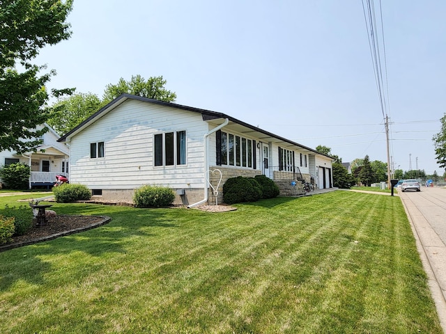 25 3rd Ave NE, Plainview, MN 55964 - view of side of home with a yard, a garage, and stone siding