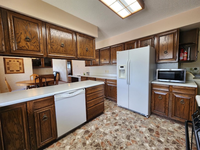 25 3rd Ave NE, Plainview, MN 55964 - kitchen featuring white appliances, light stone finish floors, light countertops, decorative backsplash, and open shelves