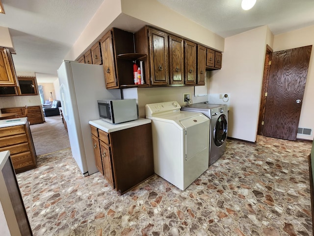 25 3rd Ave NE, Plainview, MN 55964 - washroom with independent washer and dryer and stone finish floors