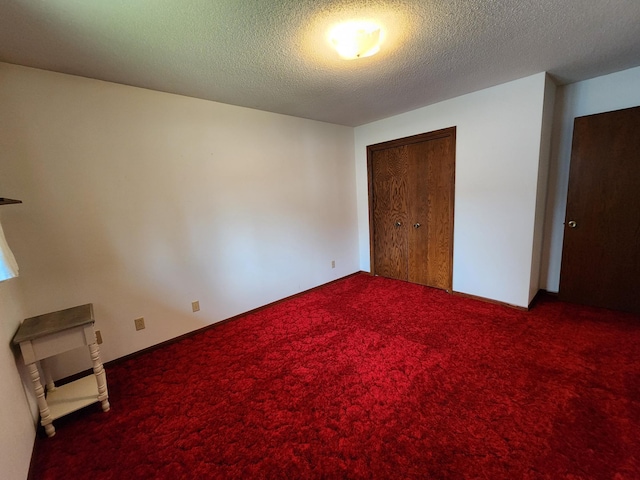 25 3rd Ave NE, Plainview, MN 55964 - unfurnished bedroom featuring carpet, a closet, and a textured ceiling