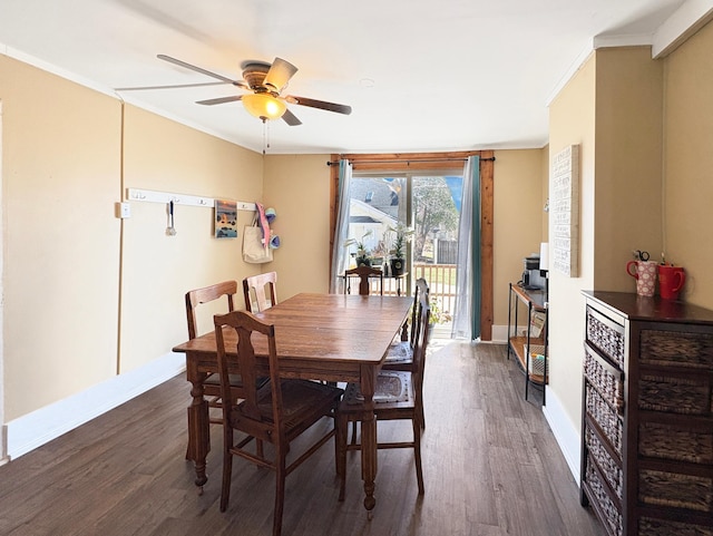 20 1st St, Luck, WI 54853 - dining room with ceiling fan, dark wood-style floors, baseboards, and crown molding