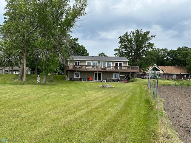 44556 Mcgowan Estates Rd, Rush Lake Twp, MN 56571 - rear view of house featuring a wooden deck and a yard