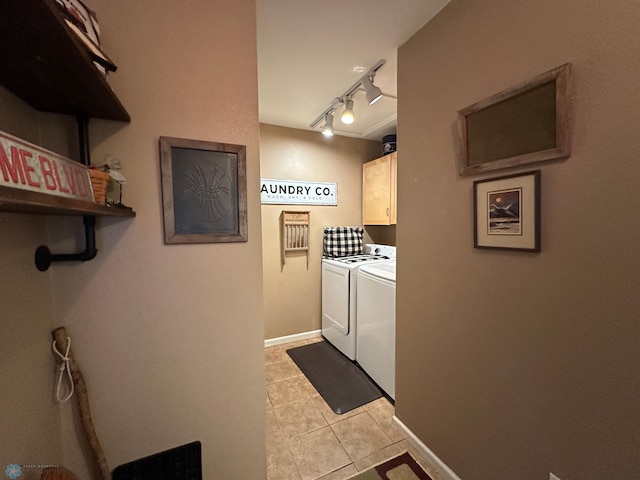 44556 Mcgowan Estates Rd, Rush Lake Twp, MN 56571 - laundry area featuring cabinet space, washing machine and dryer, light tile patterned floors, track lighting, and baseboards