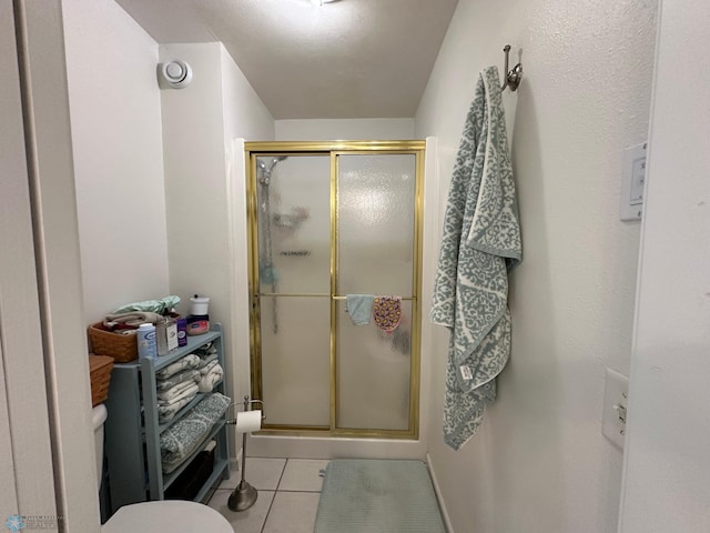 44556 Mcgowan Estates Rd, Rush Lake Twp, MN 56571 - bathroom featuring a stall shower, tile patterned floors, and toilet