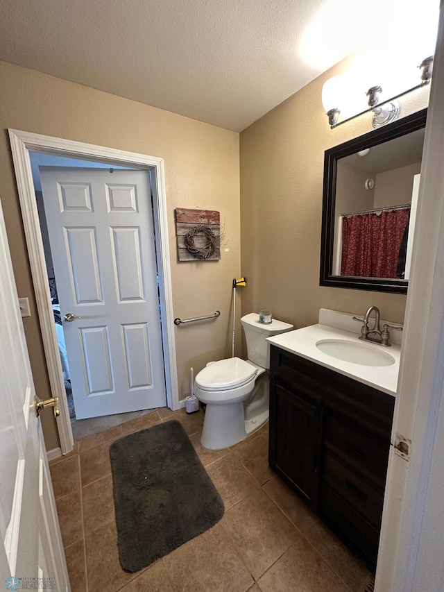 44556 Mcgowan Estates Rd, Rush Lake Twp, MN 56571 - bathroom with toilet, vanity, tile patterned flooring, and a textured ceiling
