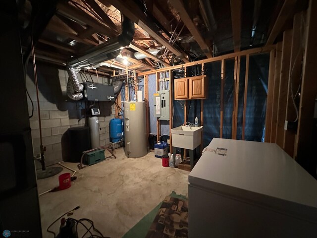 44556 Mcgowan Estates Rd, Rush Lake Twp, MN 56571 - unfinished below grade area with water heater, a sink, and a water pressure tank
