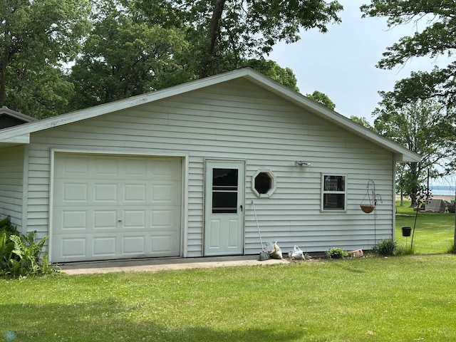 44556 Mcgowan Estates Rd, Rush Lake Twp, MN 56571 - view of front of home with a detached garage, a front yard, and an outbuilding