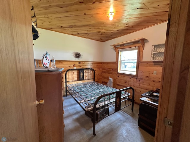 44556 Mcgowan Estates Rd, Rush Lake Twp, MN 56571 - bedroom with wainscoting, wooden walls, wood ceiling, and concrete floors