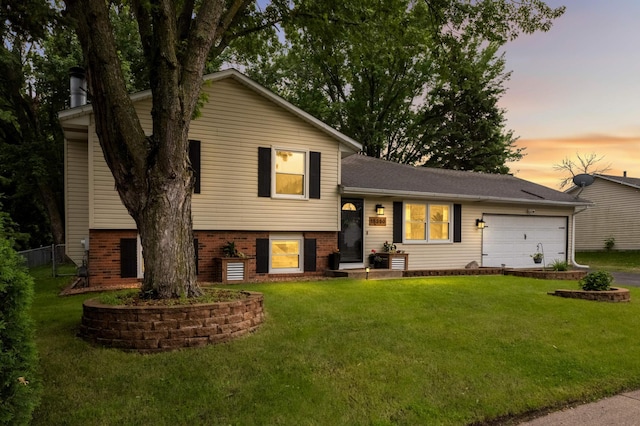 15350 Drexel Way, Apple Valley, MN 55124 - split level home featuring a garage, brick siding, and driveway