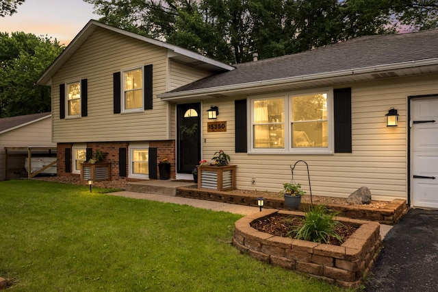 15350 Drexel Way, Apple Valley, MN 55124 - tri-level home with a lawn, a garage, brick siding, and a shingled roof