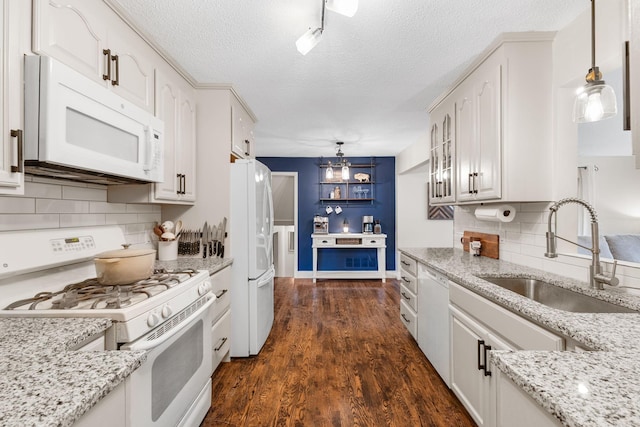 15350 Drexel Way, Apple Valley, MN 55124 - kitchen featuring white appliances, a textured ceiling, white cabinets, light stone counters, and decorative backsplash