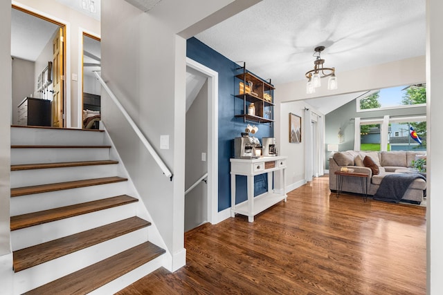 15350 Drexel Way, Apple Valley, MN 55124 - stairs with wood finished floors and a textured ceiling