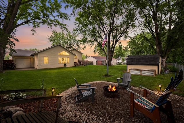 15350 Drexel Way, Apple Valley, MN 55124 - view of yard with an outdoor fire pit and a storage shed