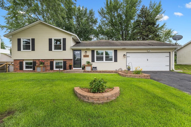15350 Drexel Way, Apple Valley, MN 55124 - split level home featuring driveway, a front yard, an attached garage, and brick siding