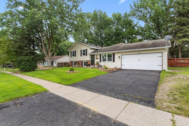 15350 Drexel Way, Apple Valley, MN 55124 - split level home featuring driveway, an attached garage, and brick siding