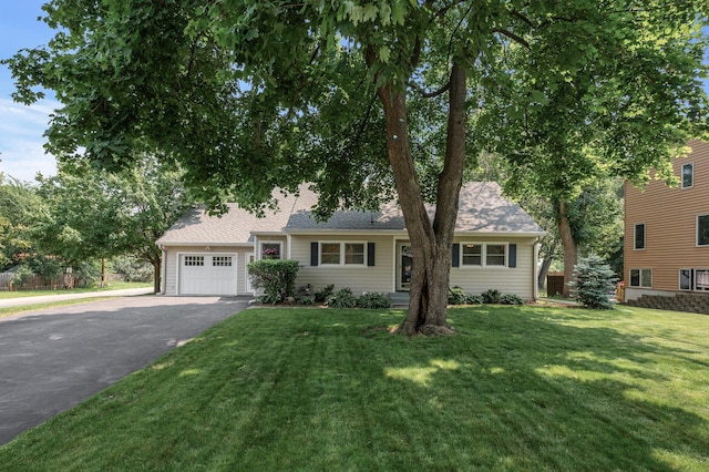 611 Sumter Ave S, Golden Valley, MN 55426 - view of front of property with a garage, asphalt driveway, a front lawn, and a shingled roof