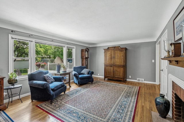 611 Sumter Ave S, Golden Valley, MN 55426 - living room featuring wood finished floors and a fireplace