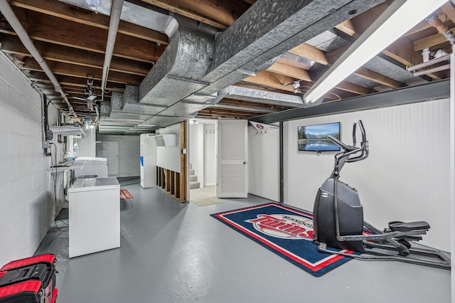 611 Sumter Ave S, Golden Valley, MN 55426 - workout area with washer / clothes dryer and concrete block wall