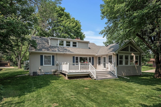 611 Sumter Ave S, Golden Valley, MN 55426 - rear view of property with a wooden deck, a yard, a chimney, and roof with shingles