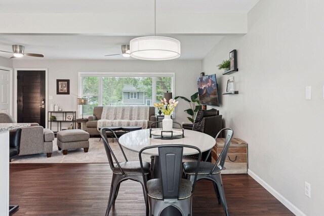 1763 Ridgewood Ave, White Bear Twp, MN 55110 - dining area featuring a ceiling fan, dark wood-style flooring, and baseboards