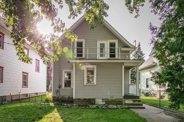 1311 Monroe St NE, Minneapolis, MN 55413 - rear view of house featuring a balcony