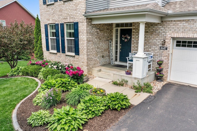 8607 Portage Ln E, Shakopee, MN 55379 - doorway to property with brick siding and roof with shingles